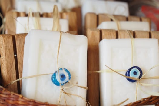 Stack of soap topped with evil eye beads