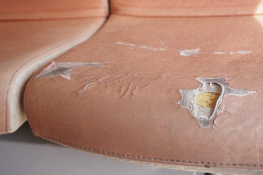 damage Leather with a cracked texture on a sofa