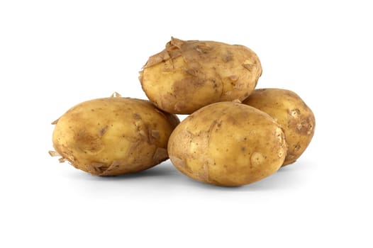 Group of fresh early potatoes, with a light brown skin and dark brown spots isolated on a white background