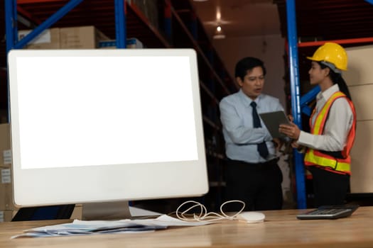 Computer with green screen display in warehouse storage room . Delivery and transportation software concept .