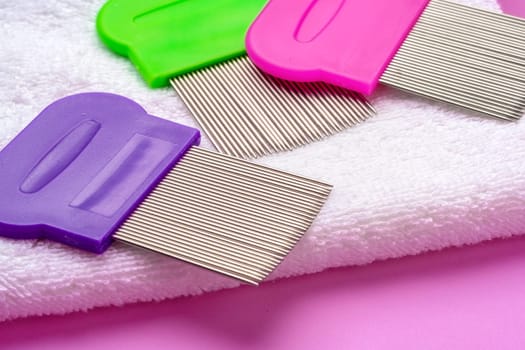 Three combs for removing lice and nits on lilac background close up