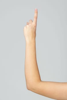 Young Woman Arm with Gesture close up on gray background