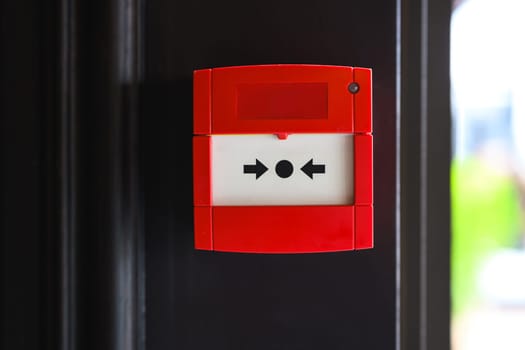 Full front view of outdoor wall mounted fire alarm button
