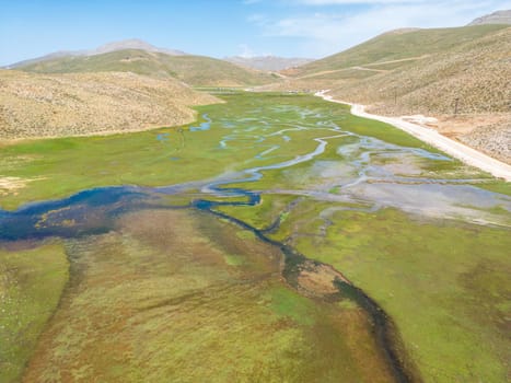 The meander in Antalya Sobucimen plateau. Aerial view of complex waterways weaving  through lush green fields