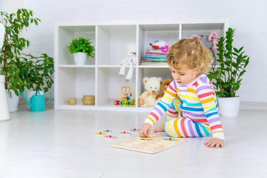 Child learns numbers game logic. Selective focus. Baby.