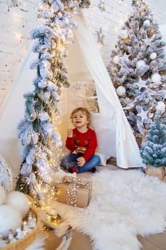 Child in his room decor christmas. Selective focus. Kid.