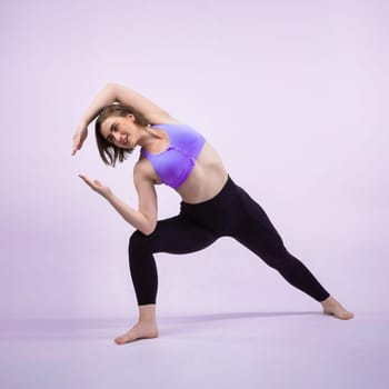 Full body length gaiety shot athletic and sporty woman doing healthy and meditative yoga exercise workout posture on isolated background. Healthy active and body care lifestyle