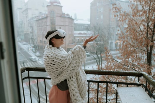 Amidst the winter cityscape, a lovely lady experiences virtual reality with VR glasses. High quality photo