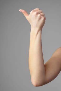 Woman Holding Arm Up in the Air with Gesture close up