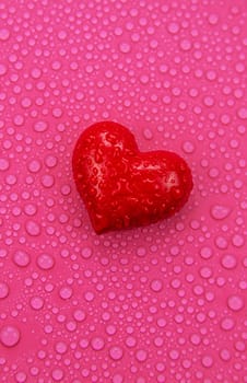 Wet heart background valentine. Selective focus. Red love.