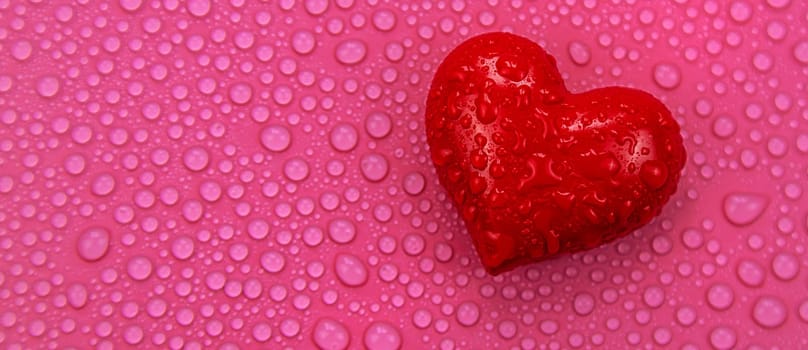 Wet heart background valentine. Selective focus. Red love.