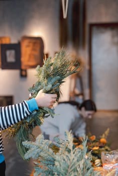 Crafting workshop focusing on Christmas wreath making and New Year's decor. High quality photo