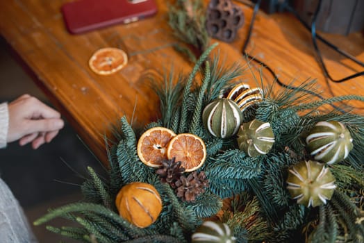 Workshop on designing holiday wreaths and New Year's embellishments. High quality photo