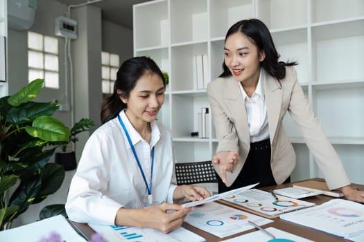 Business people discussing and brainstorming together in conference room during meeting at office. Strategy, Planning, Teamwork.