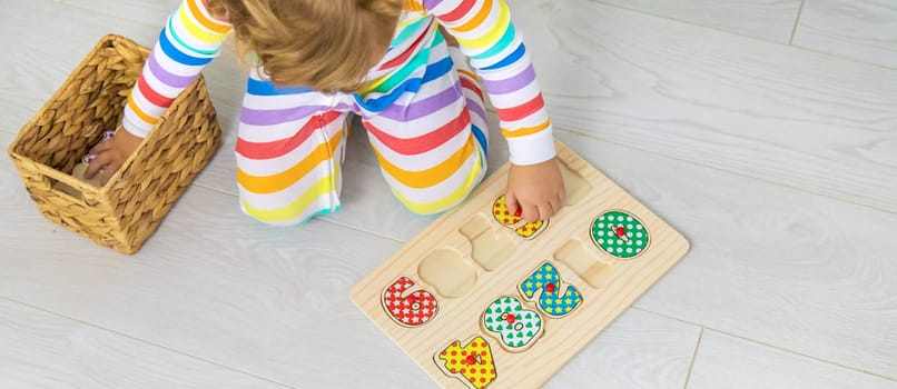 Child learns numbers game logic. Selective focus. Baby.