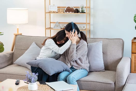 pride month. Happy woman lesbian gay lgbt couple celebrating love together during relax at home. lgbtq couple concept.