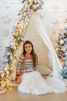 Child in his room decor christmas. Selective focus. Kid.