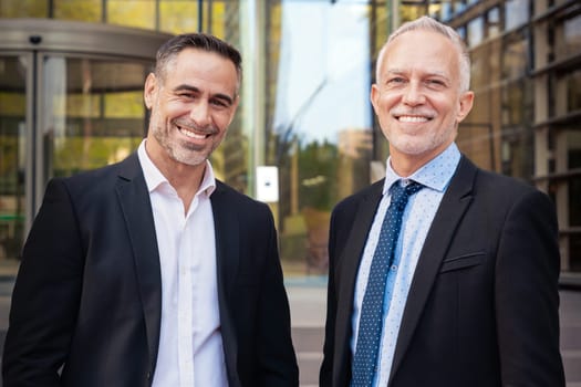 Two Trusted Business Colleagues Dressed In Formal Suit Walking Together Outside Work Center During Work Meeting.