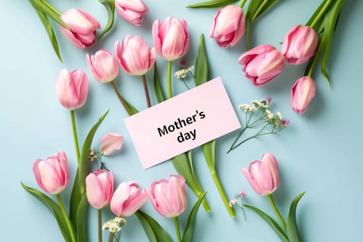 Mother's Day: Pink tulips, gypsophila and card with text Hello March on blue background