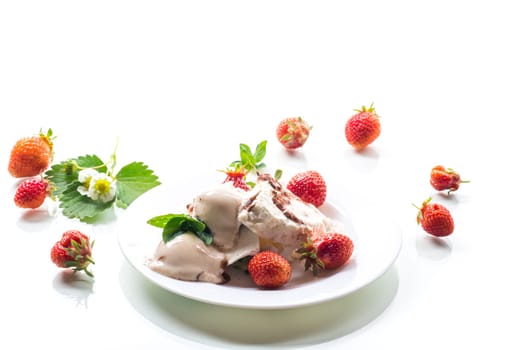 fresh organic cottage cheese with strawberries and ice cream in a plate isolated on white background .