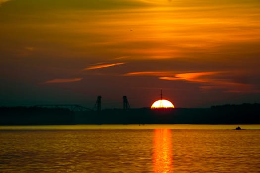 Golden sunset on the beach at neva river in saint-petersburg, russia. Tranquil scene. Nature background. Landscape. High quality photo