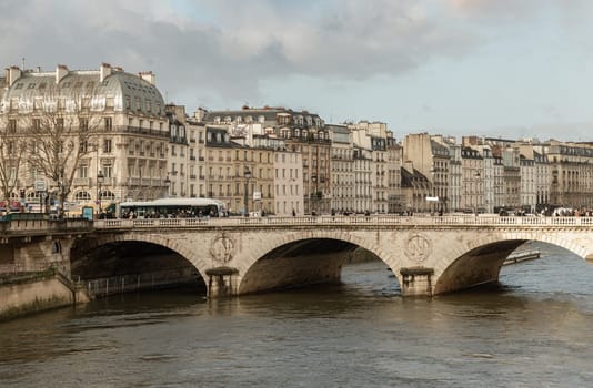 France, Paris - Jan 03, 2024 - View of Pont Saint-Michel or Saint Michel bridge across the Seine river in Paris. Space for text, Selective focus.