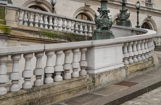 France, Paris - Jan 04, 2024 - Pathway with white handrail leading to the Entrance to The opera house Palais Garnier. Architectural details of The Palais Garnier (Opera National de Paris). Place de l'Opéra (Opera Garnier) is famous Neo-baroque building in Paris, UNESCO World Heritage Site, Copy space, Selective focus.