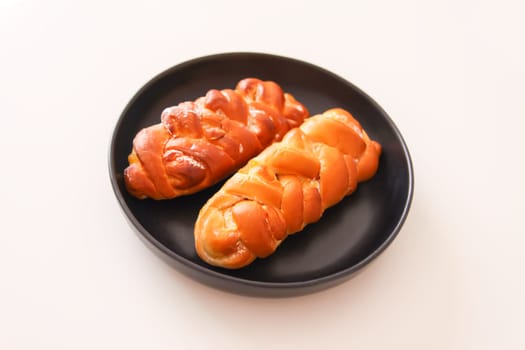 Freshly baked sweet buns. Homemade pastry on white background.