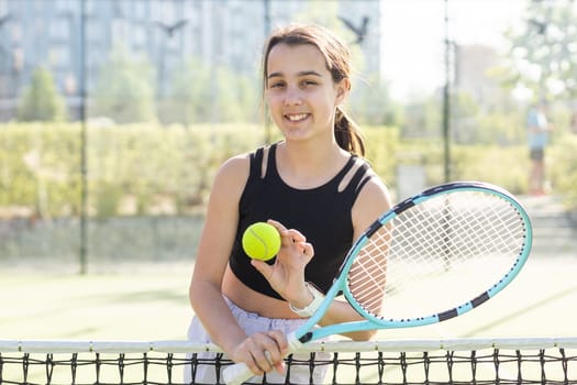 Young woman playing tennis on court. High quality photo