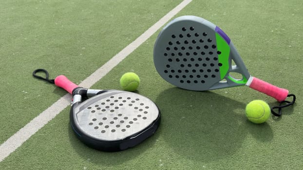 Paddle tennis objects on grass court. High quality photo