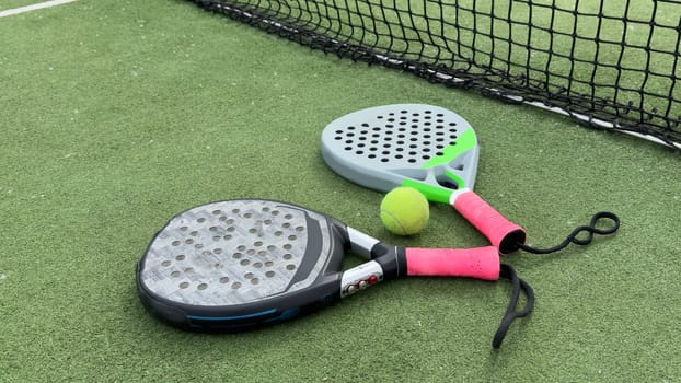 paddle rackets on the playing court. High quality photo