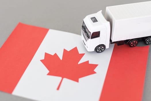 Symbol of National Delivery Truck with Flag of Canada. National Trucking Icon and Canadian flag. High quality photo