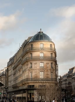 France, Paris - Jan 03, 2024 - Facade of The Kenzo building with typical balconies and windows. Kenzo building juts out between the Belle Jardiniere property and the Samaritaine department store in Paris, Space for text, Selective focus.