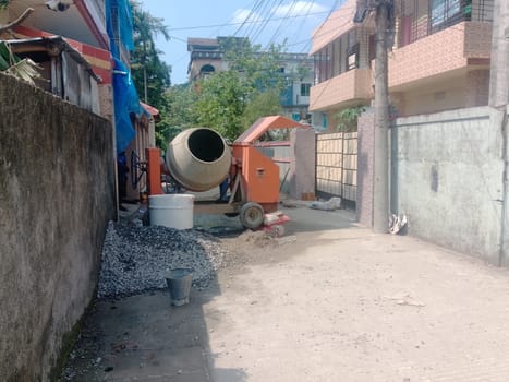 A concrete mixer in a yard. High quality photo