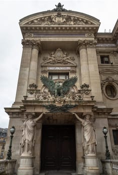 France, Paris - Jan 04, 2024 - Entrance to the opera house Palais Garnier with caryatids. Architectural details of The Palais Garnier (Opera National de Paris). Place de l'Opéra (Opera Garnier) is famous Neo-baroque building in Paris, UNESCO World Heritage Site, Copy space, Selective focus.