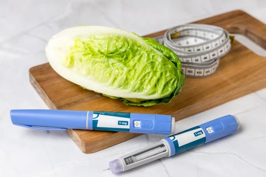 Original Danish Ozempic Insulin injection pen for diabetics and vegetables. Denmark - May 2, 2024
