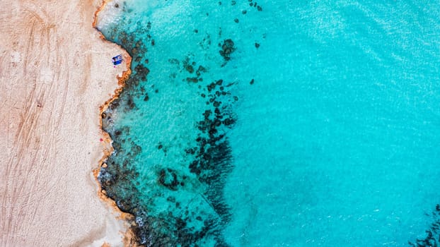 Aerial view of beautiful Nissi beach in Ayia Napa, Cyprus. Nissi beach in Ayia Napa famous tourist beach in Cyprus. A view of a azzure water and Nissi beach in Aiya Napa, Cyprus.