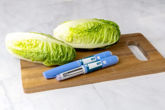 Original Danish Ozempic Insulin injection pen for diabetics and vegetables. Denmark - May 2, 2024