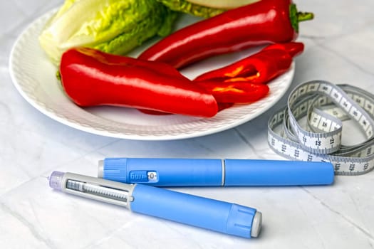 Original Danish Ozempic Insulin injection pen for diabetics and plate with vegetables. High quality photo