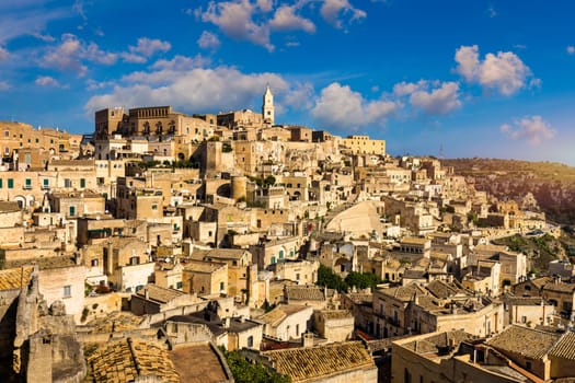 Panoramic view of the ancient town of Matera (Sassi di Matera) in a beautiful autumn day, Basilicata, southern Italy. Stunning view of the village of Matera. Matera is a city on a rocky outcrop.