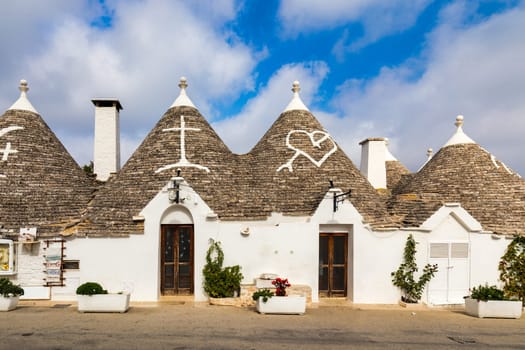 The traditional Trulli houses in Alberobello city, Apulia, Italy. Cityscape over the traditional roofs of the Trulli, original and old houses of this region, Apulia, Alberobello, Puglia, Italy. 