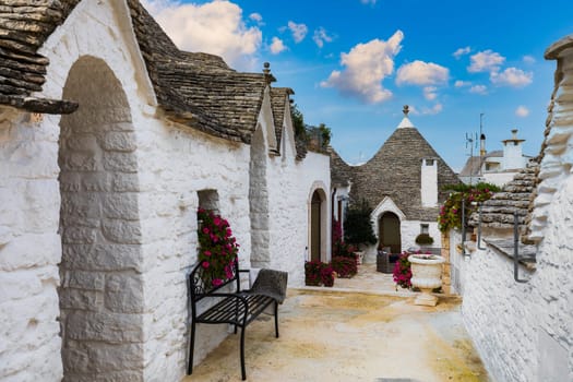 The traditional Trulli houses in Alberobello city, Apulia, Italy. Cityscape over the traditional roofs of the Trulli, original and old houses of this region, Apulia, Alberobello, Puglia, Italy. 