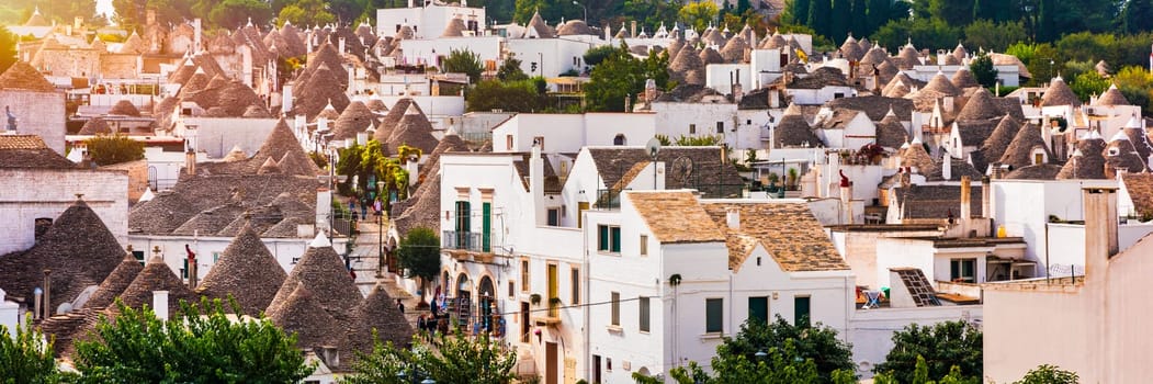 The traditional Trulli houses in Alberobello city, Apulia, Italy. Cityscape over the traditional roofs of the Trulli, original and old houses of this region, Apulia, Alberobello, Puglia, Italy. 