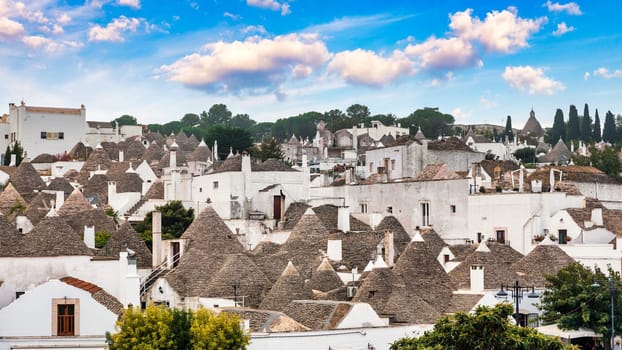The traditional Trulli houses in Alberobello city, Apulia, Italy. Cityscape over the traditional roofs of the Trulli, original and old houses of this region, Apulia, Alberobello, Puglia, Italy. 
