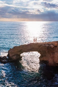 Beautiful bridge of lovers natural rock arch near of Ayia Napa, Cavo Greco and Protaras on Cyprus island, Mediterranean Sea. Legendary bridge lovers. Amazing blue green sea and sunny day