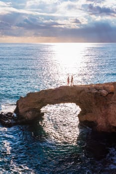 Beautiful bridge of lovers natural rock arch near of Ayia Napa, Cavo Greco and Protaras on Cyprus island, Mediterranean Sea. Legendary bridge lovers. Amazing blue green sea and sunny day