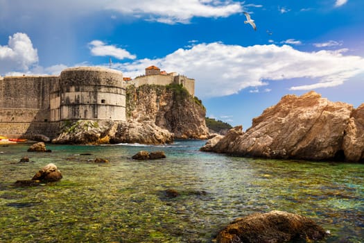 Dubrovnik a city in southern Croatia fronting the Adriatic Sea, Europe. Old city center of famous town Dubrovnik, Croatia. Picturesque view on Dubrovnik old town (medieval Ragusa) and Dalmatian Coast.