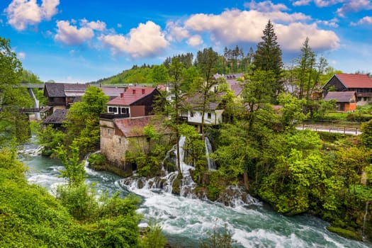 Village of Rastoke near Slunj in Croatia, old water mills on waterfalls of Korana river, beautiful countryside landscape. Landscape with river and little waterfalls in Rastoke village, Croatia.