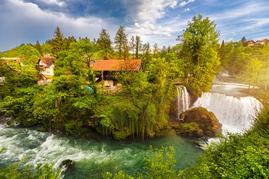 Village of Rastoke near Slunj in Croatia, old water mills on waterfalls of Korana river, beautiful countryside landscape. Landscape with river and little waterfalls in Rastoke village, Croatia.