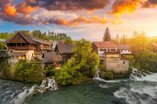 Village of Rastoke near Slunj in Croatia, old water mills on waterfalls of Korana river, beautiful countryside landscape. Landscape with river and little waterfalls in Rastoke village, Croatia.